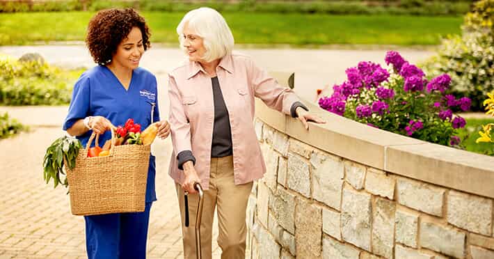 BrightStar Nurse and Patient walking 